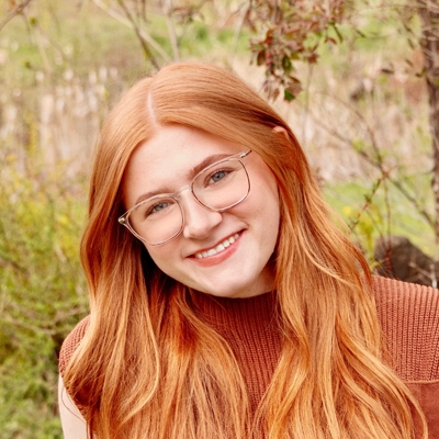 Carly Twining, LMT smiling outside.